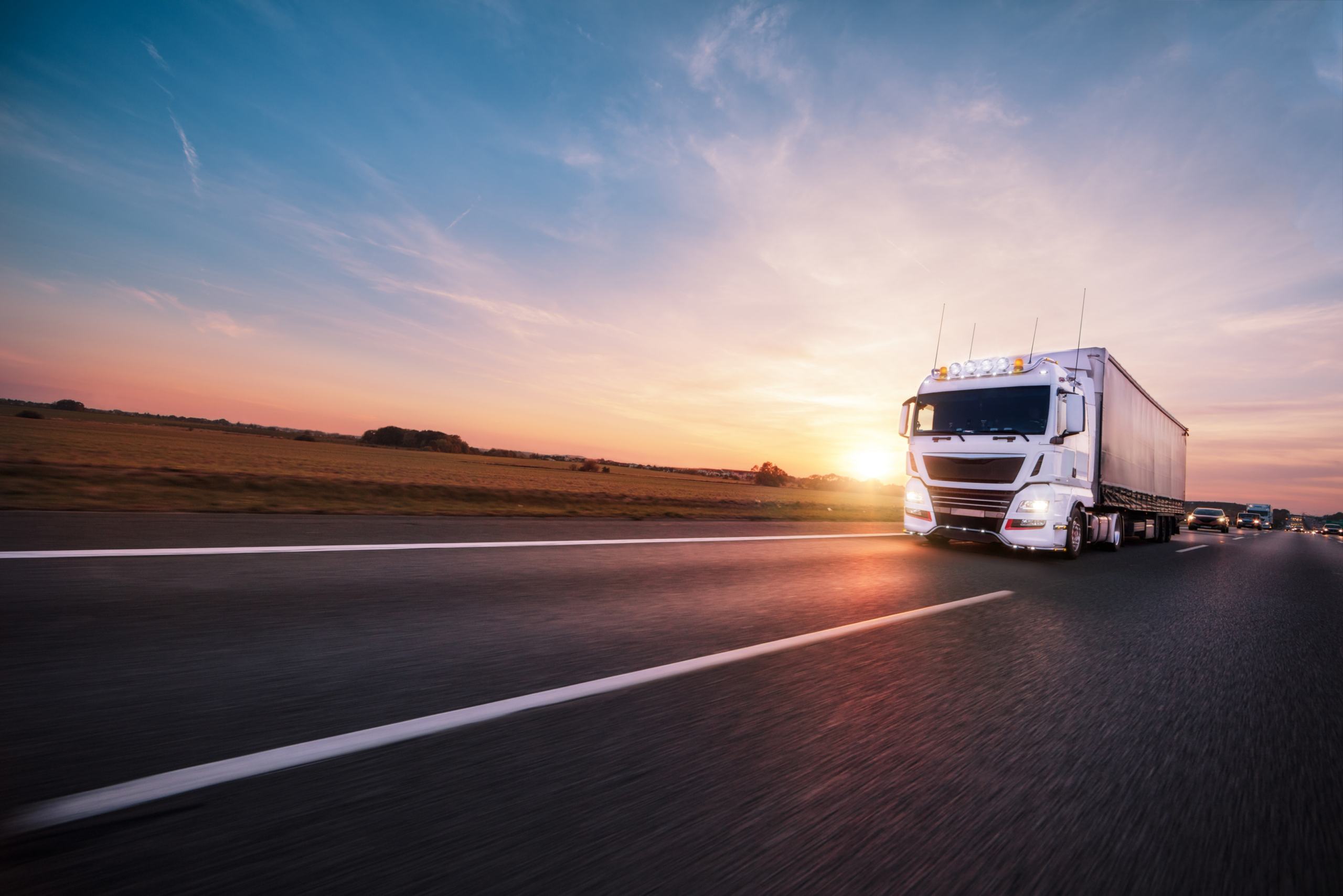 Truck on highway at sunset — logistics transport